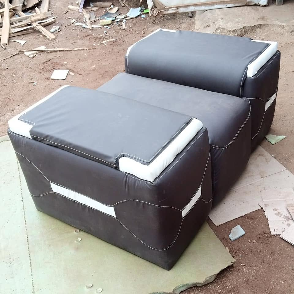Black and white contrast upholstered armchair shown in a reclined workshop view