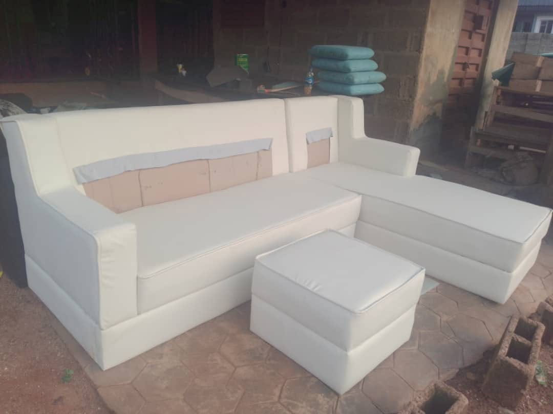 White upholstered sectional arranged at the workshop, shown from the front