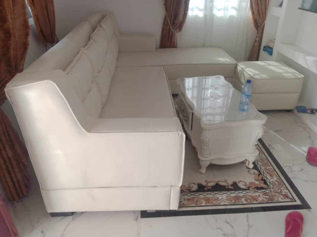 White upholstered sectional shown in a finished home interior
